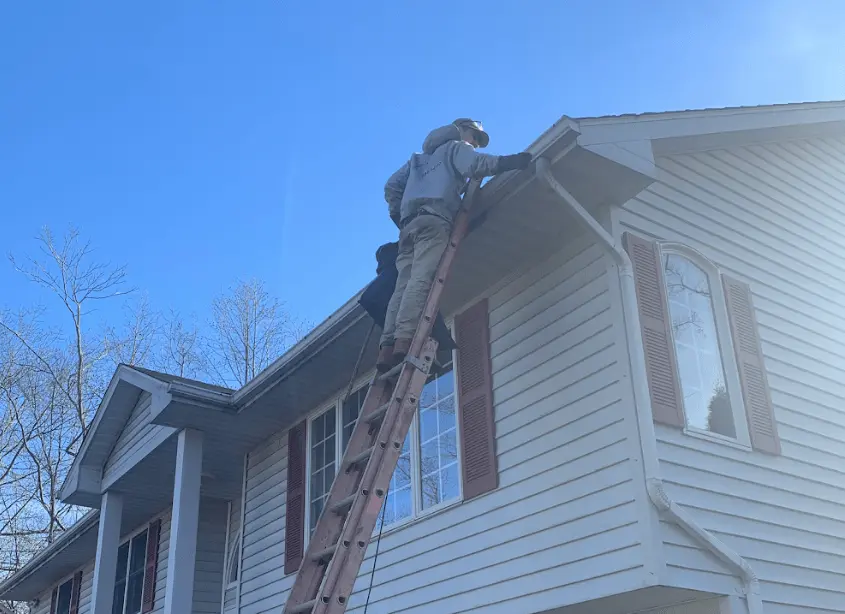 Gutter cleaning and maintenance being performed by Mayfield Heights Power Washing in Mayfield Heights